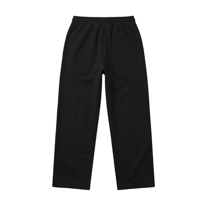 Wide leg baggy sweatpants in black, shown from the back on a plain white background, featuring an elastic waistband and a single right back pocket.